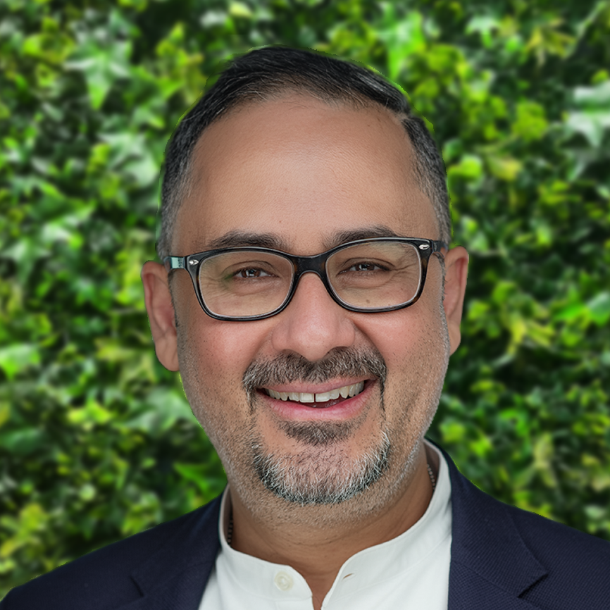 Smiling man wearing glasses outdoors